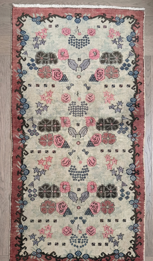 Overhead shot of a semi-antique, anatolian, floral, natural dye, wool rug