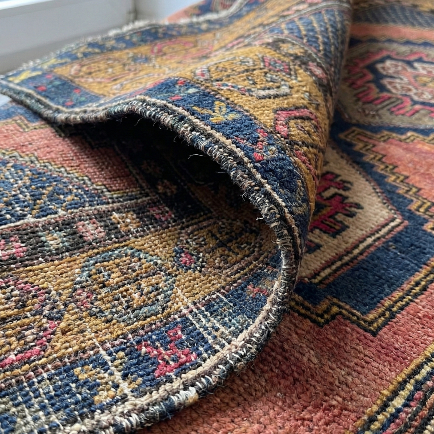 Close-up of an Anatolian rug with a focus on the texture and colors