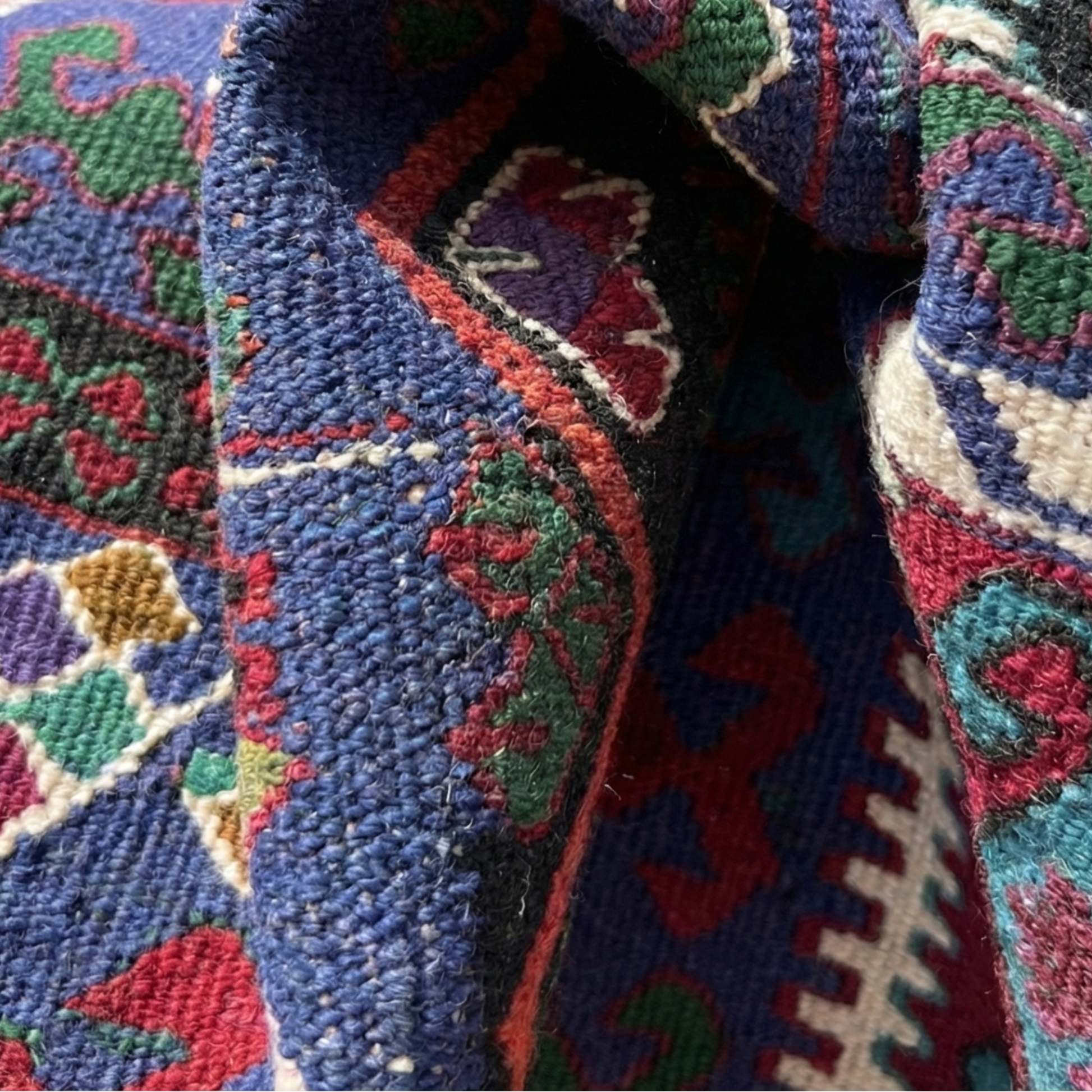 Close-up of a colorful woven Anatolian kilim with intricate patterns