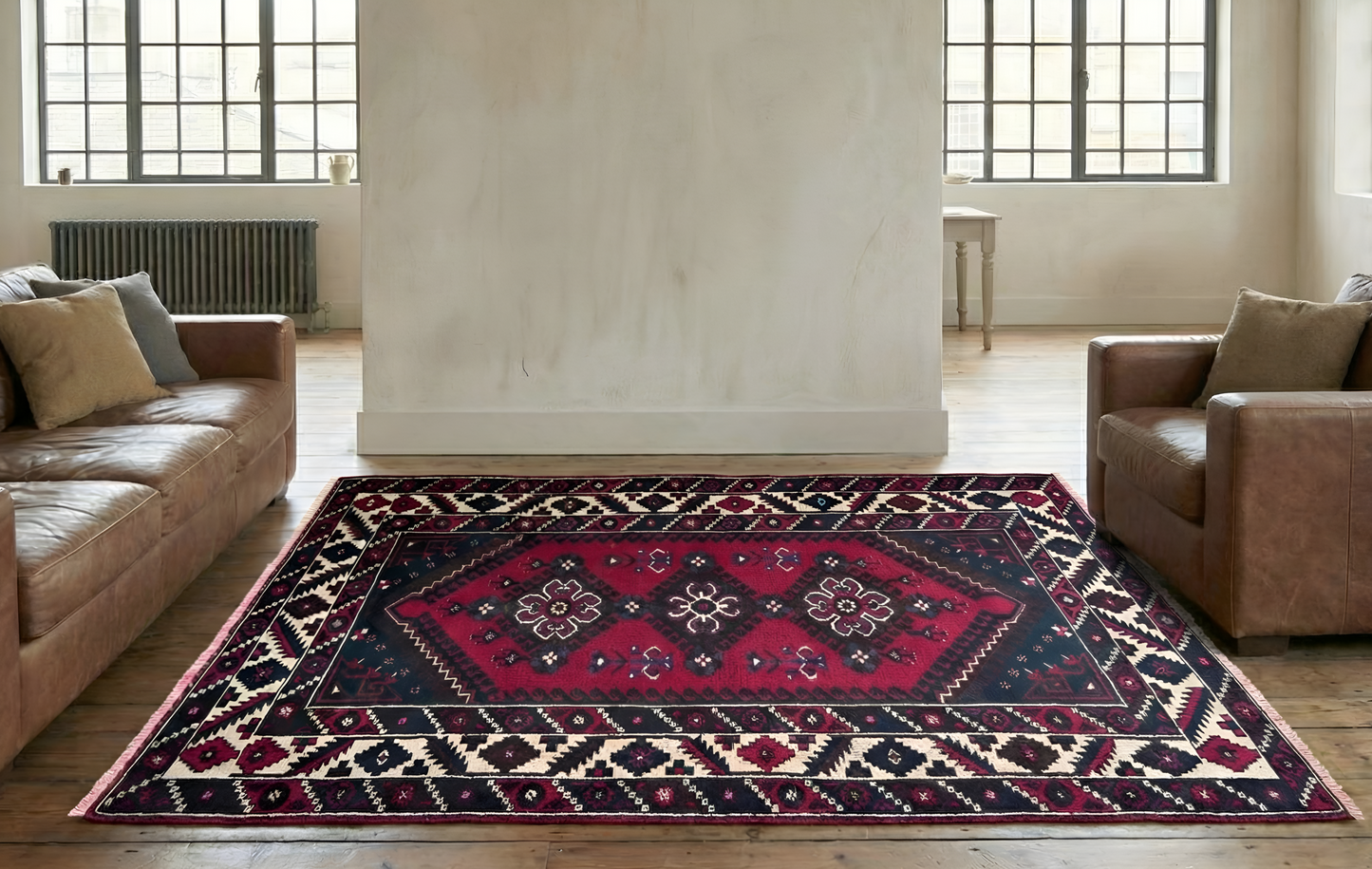 Triple medallion Anatolian rug styled in Amsterdam loft with minimalist design