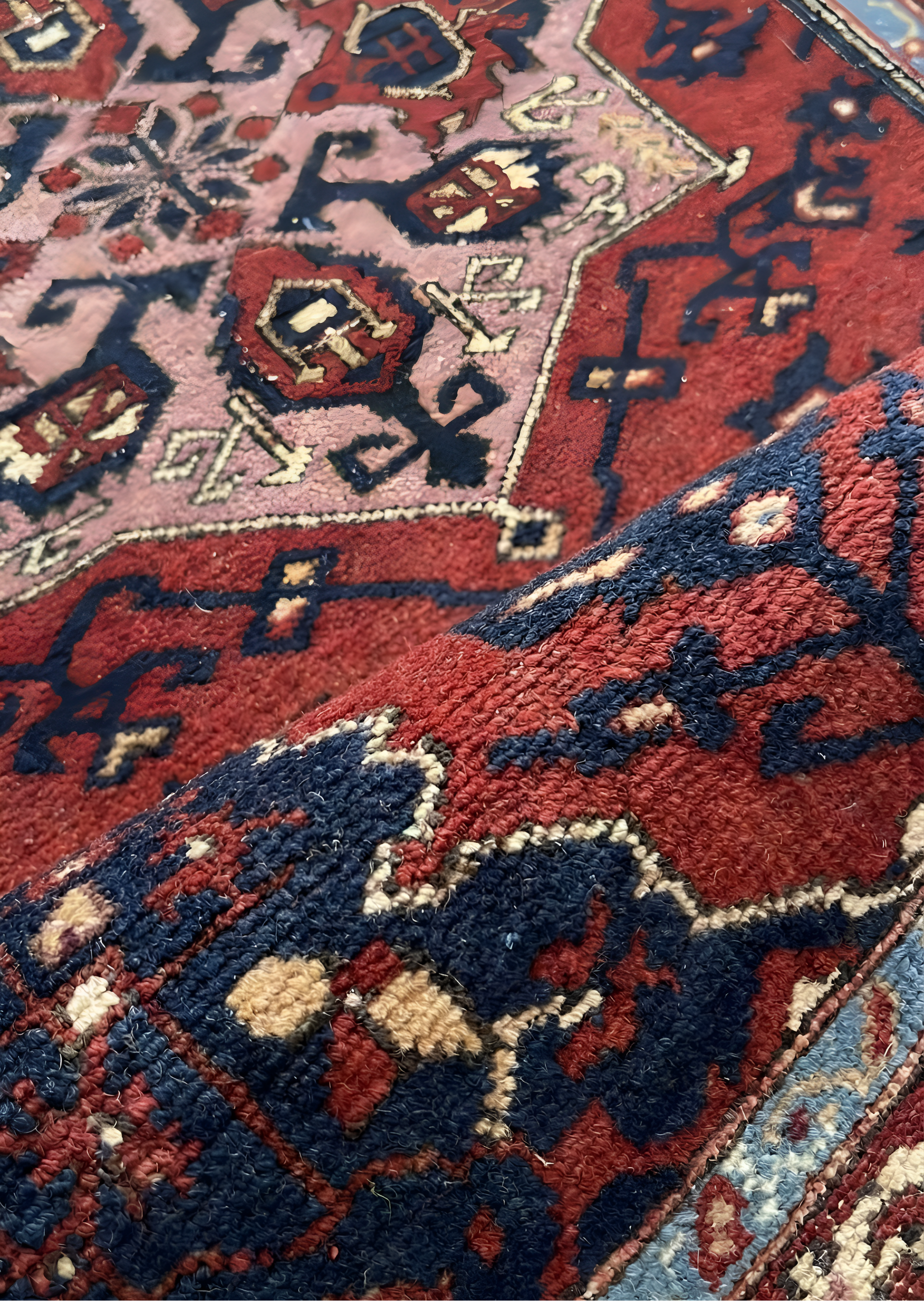 Close-up of an Anatolian wool rug with red, blue, and beige colors