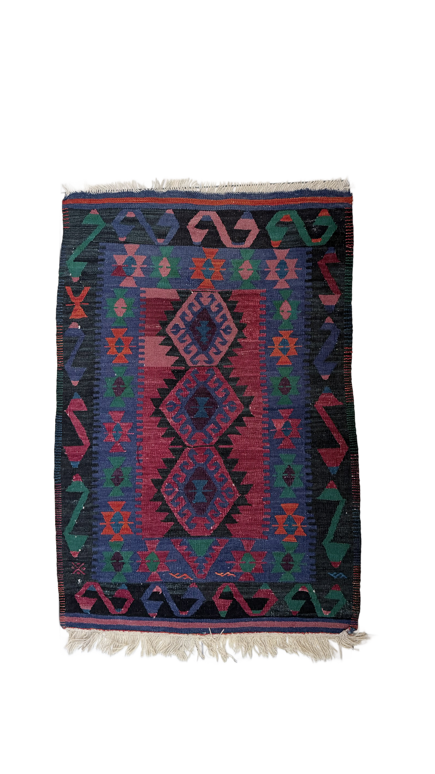 Colorful patterned turkish rug with geometric design on a white background