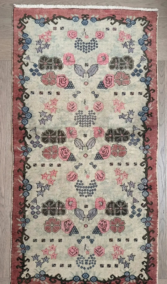 Overhead shot of a semi-antique, anatolian, floral, natural dye, wool rug