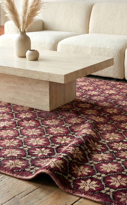 Living room with an Anatolian patterned rug, beige sofa, and wooden coffee table.