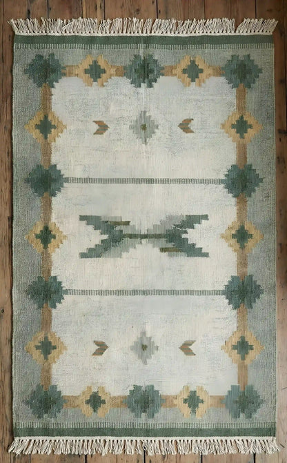 Anatolian kilim rug with geometric pattern on a wooden floor
