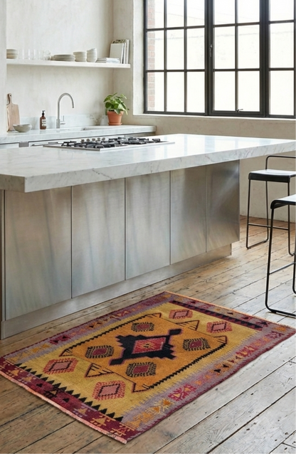Modern kitchen with a decorative Anatolian kilim rug on wooden flooring