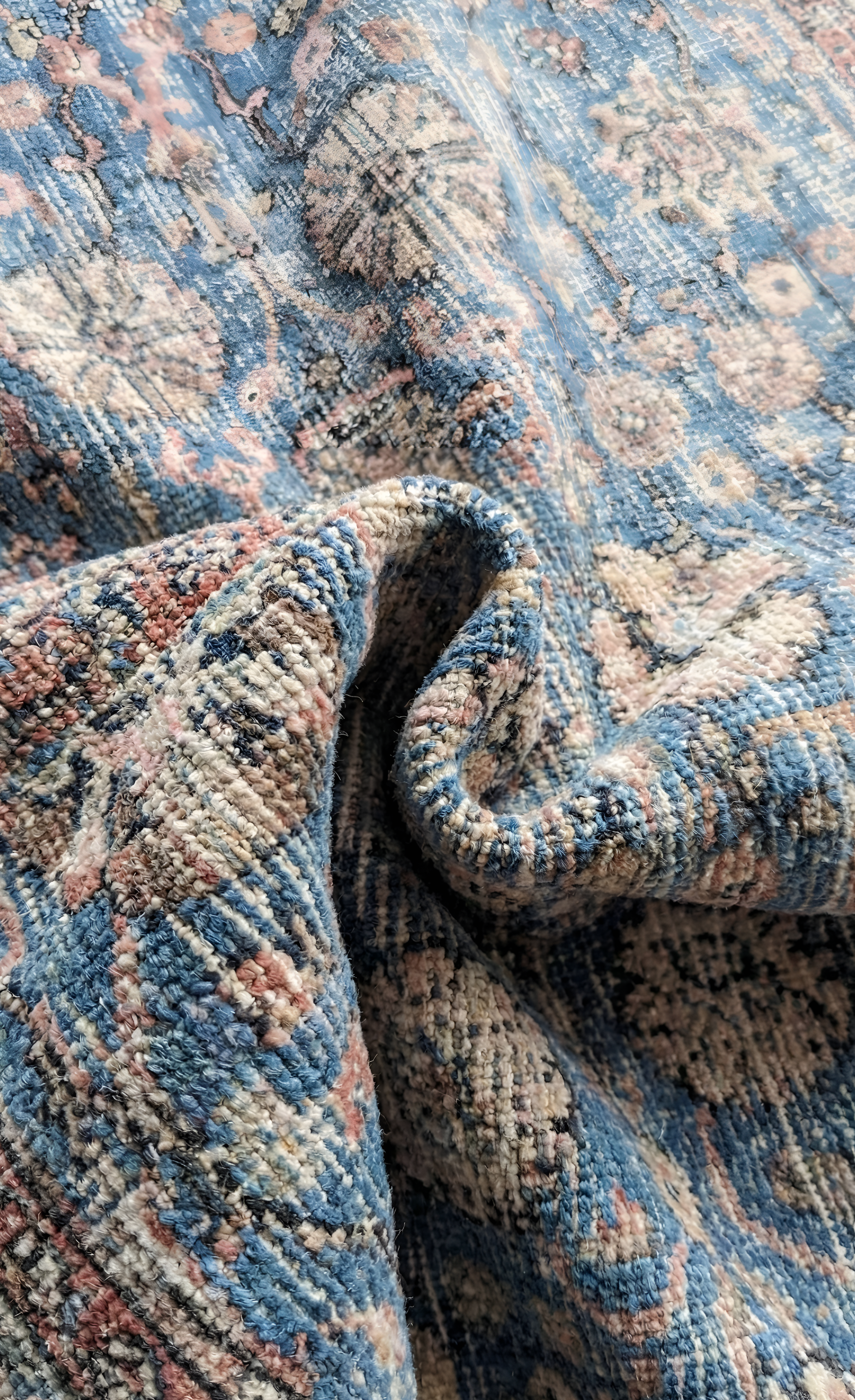Close-up of a stonewashed blue and beige Anatolian wool rug