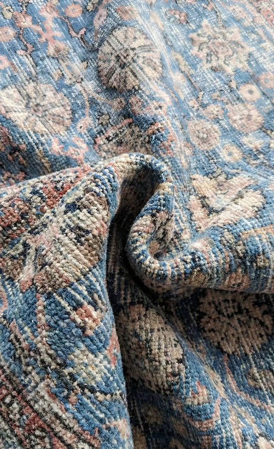 Close-up of a stonewashed blue and beige Anatolian wool rug