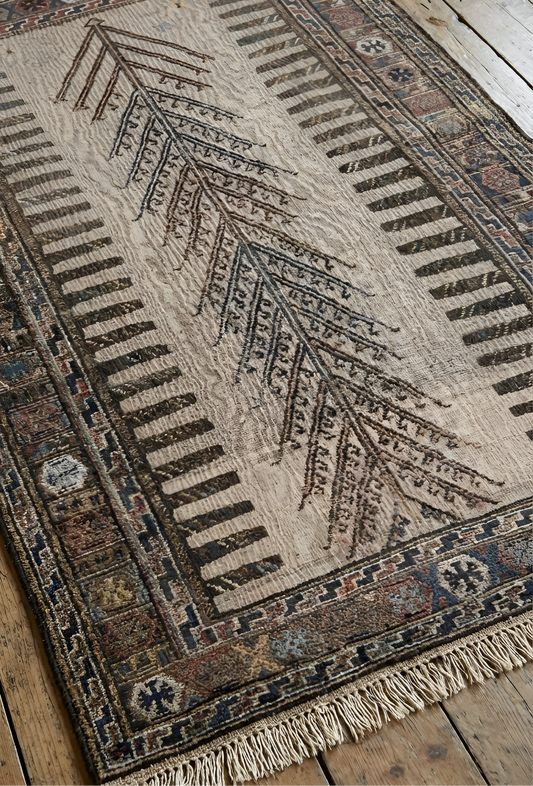 Anatolianrug with intricate patterns on a wooden floor
