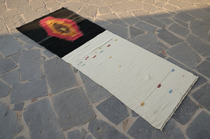 Anatolian kilim runner on a stone pavement