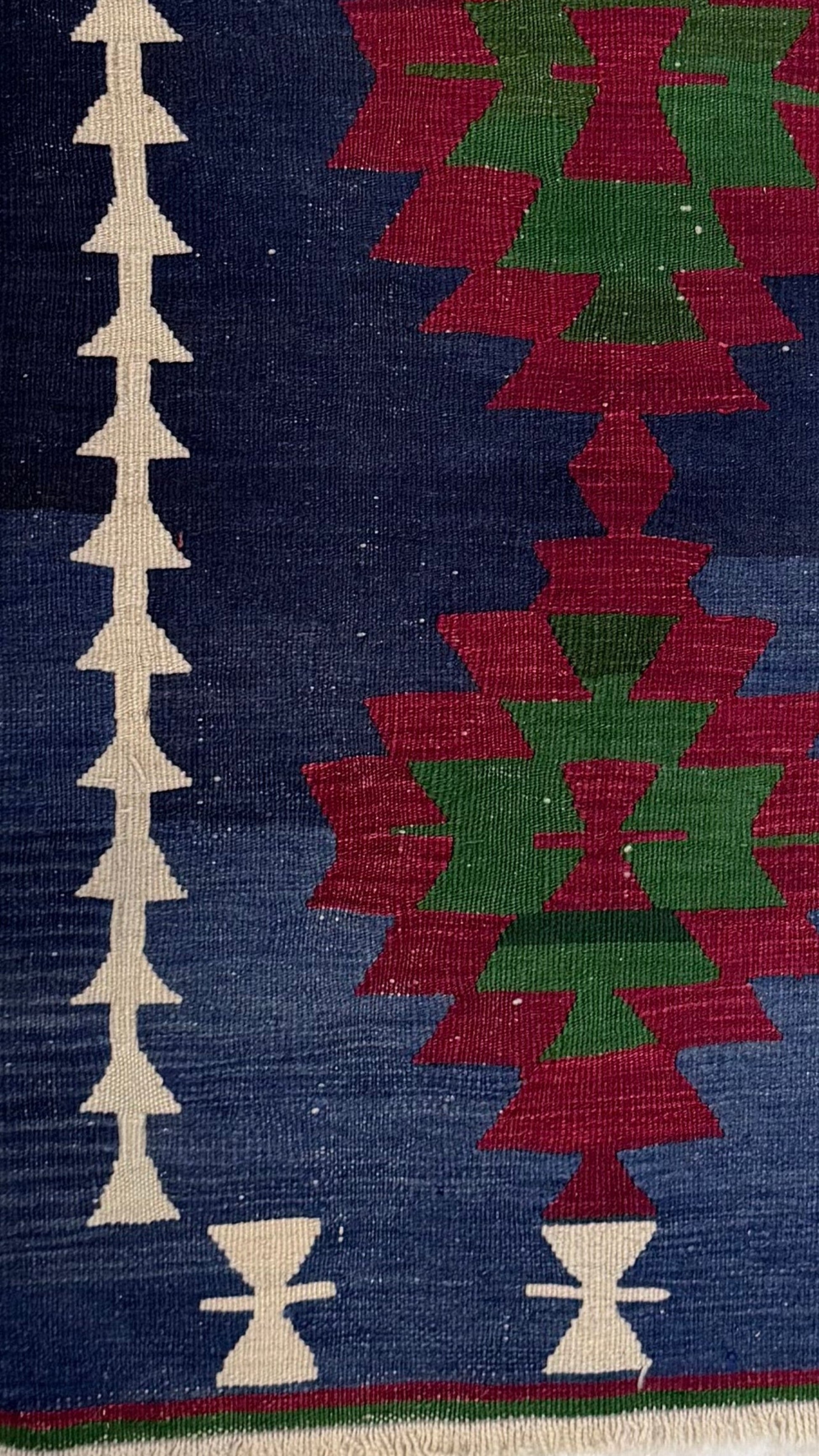 Close-up of a patterned Anatolian kilim rug with geometric designs