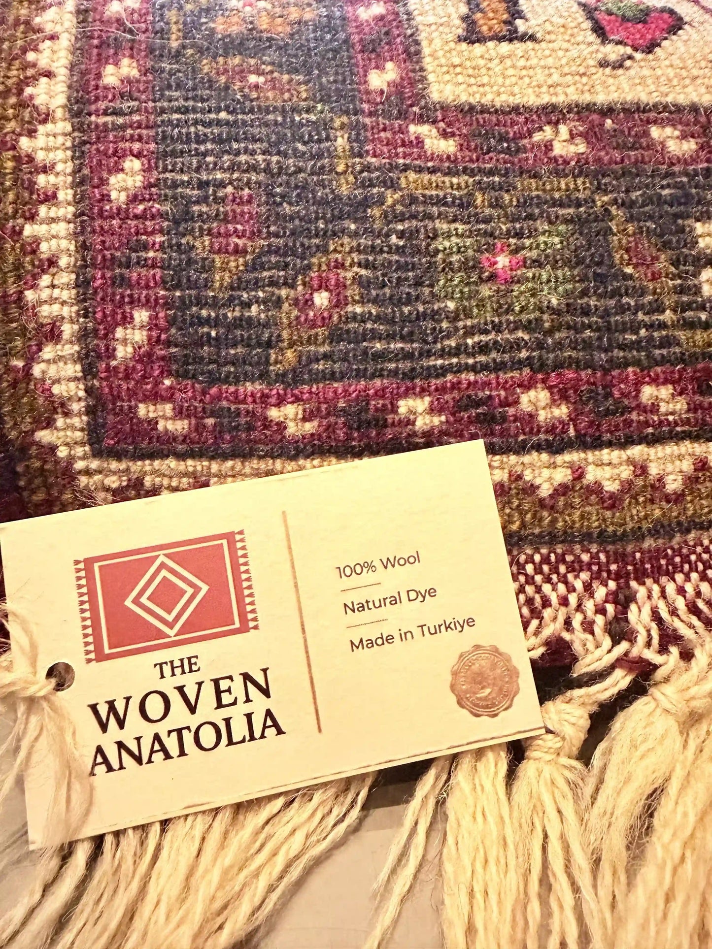 Woven Anatolia label on a textured fabric background
