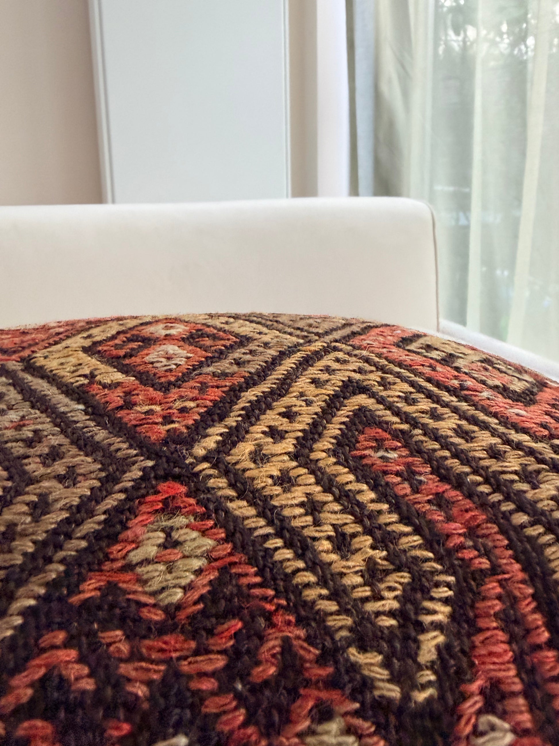 Handwoven Anatolian kilim cushion cover with traditional geometric diamond motifs in terracotta and charcoal wool