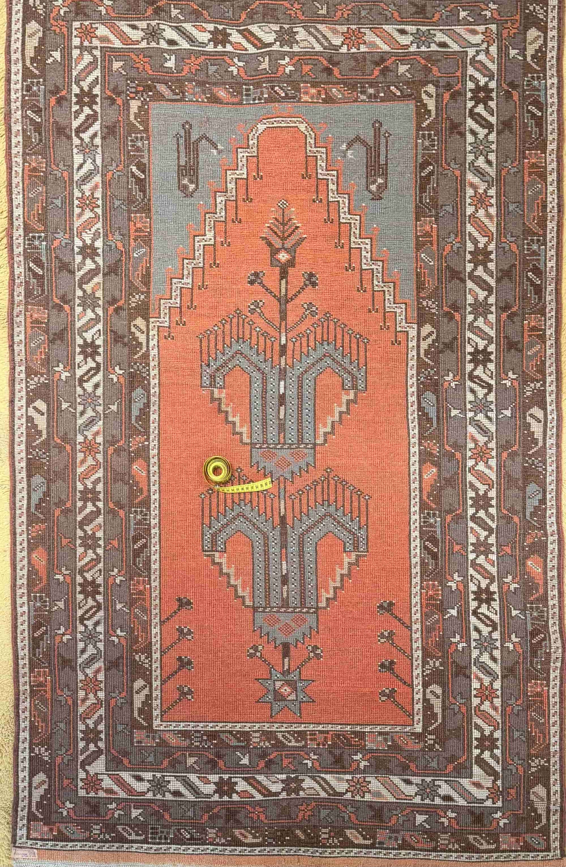 Overhead of a hand-knotted authentic Turkish rug, oriental, natural dye and wool