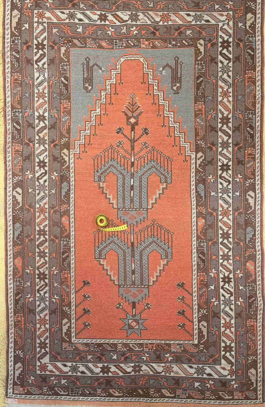 Overhead of a hand-knotted authentic Turkish rug, oriental, natural dye and wool