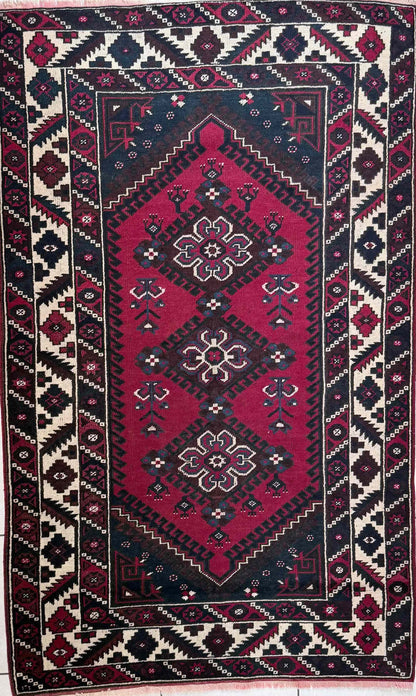 Handknotted wool rug in red, cream and charcoal 